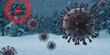 Urgent CDC warning symbol against a winter background with COVID-19 particles