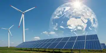 Clean energy infrastructure under a clear blue sky, representing reduced emissions and environmental progress.