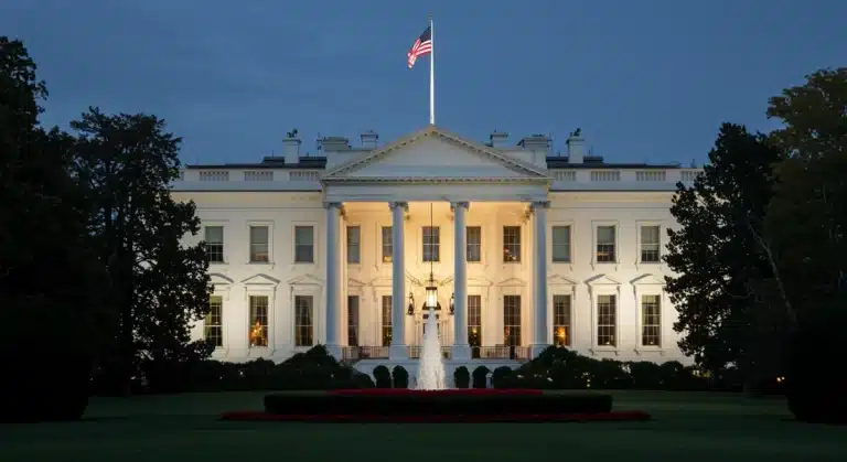 White House at dusk, symbolizing the new 2026 presidential administration and upcoming policy changes.